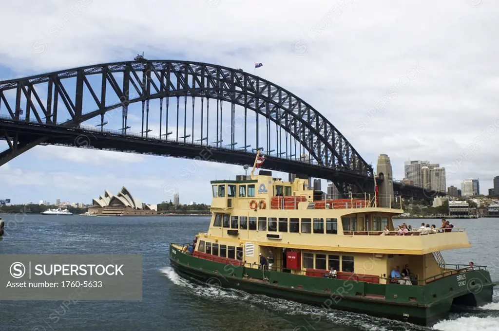 Australia, New South Wales, Sydney, Harbour ferry passing beneath Harbour Bridge, Heading towards Opera House