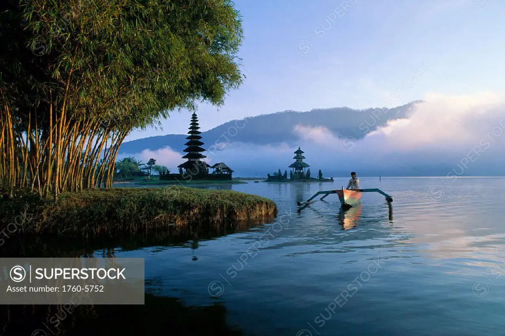 Indonesia, Bali, Lake Bratan Ulu Danu Temple at sunrise, person in canoe A62A