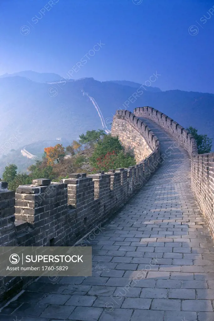 China, Mutianyu, along path of The Great Wall with misty blue skies C1851