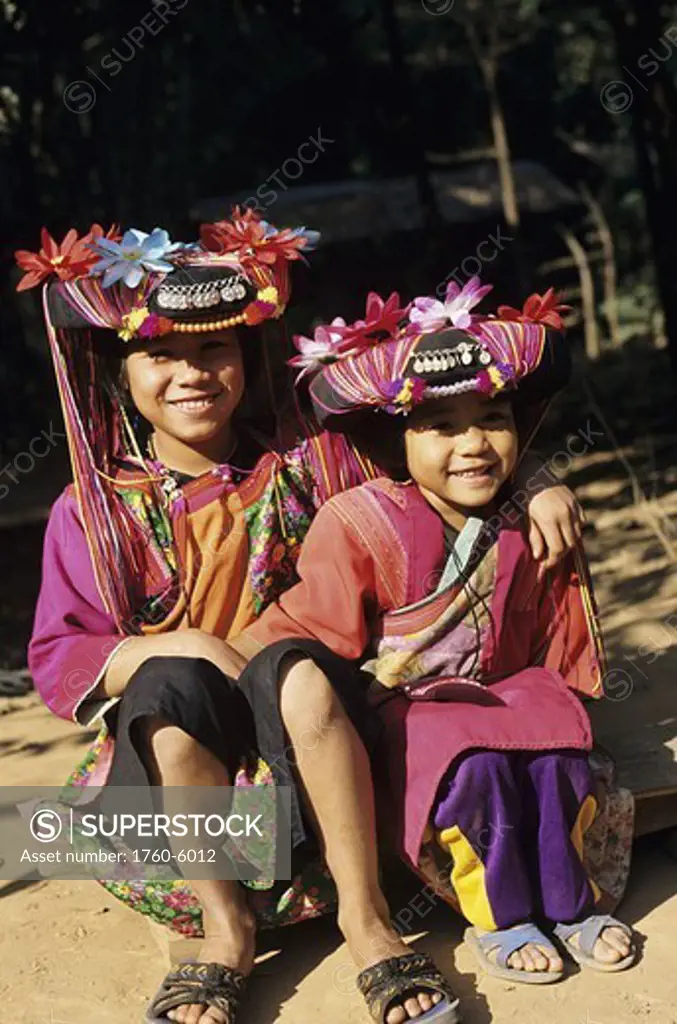 Thailand, Chiang Mai, Two hill tribe children in brightly colored clothing