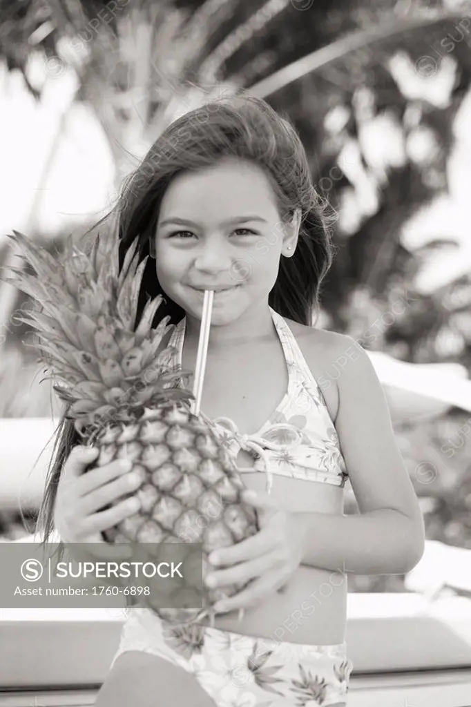 Little girl drinking from pineapple Sepia photograph 