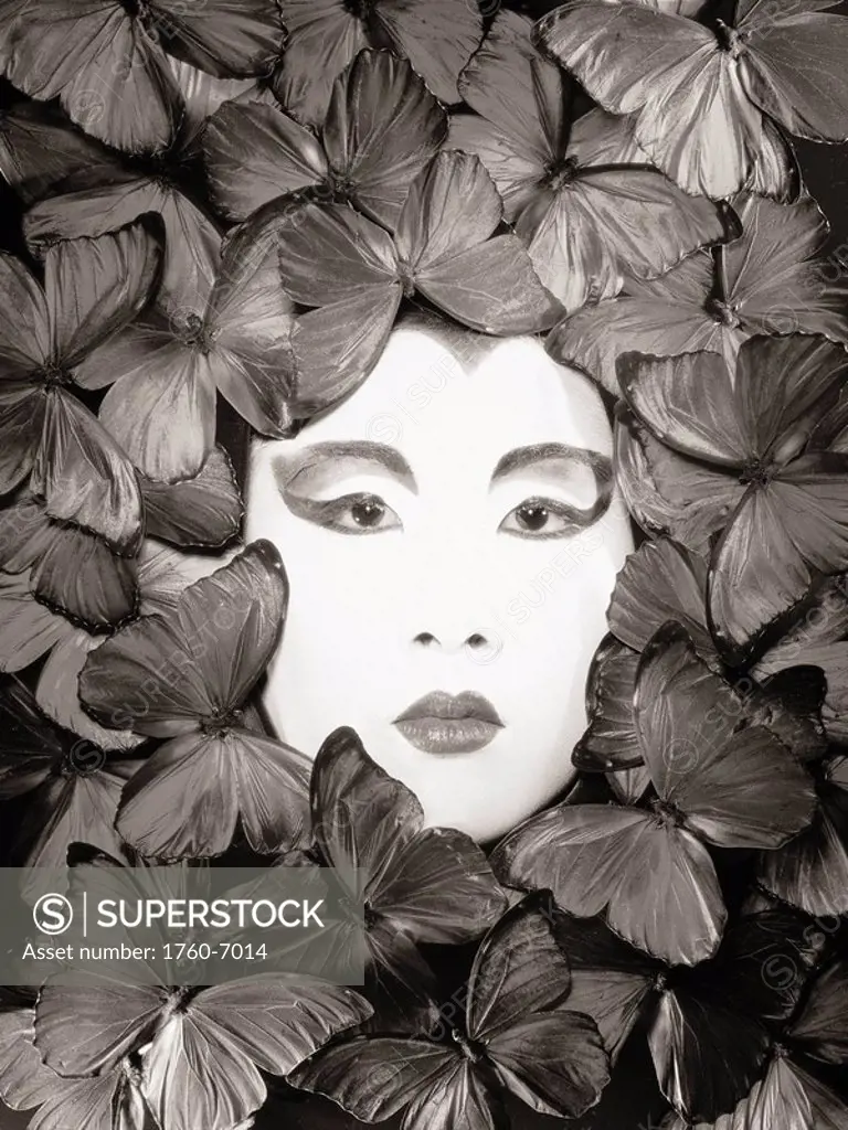 Asian woman, Painted white face surrounded by butterflies Sepia photograph 
