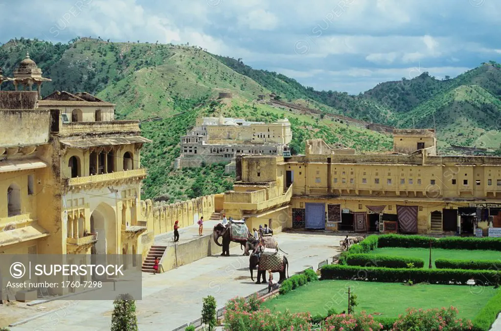 India, Jaipur, inside Amber Fort, landscaped court yard, elephants and people 