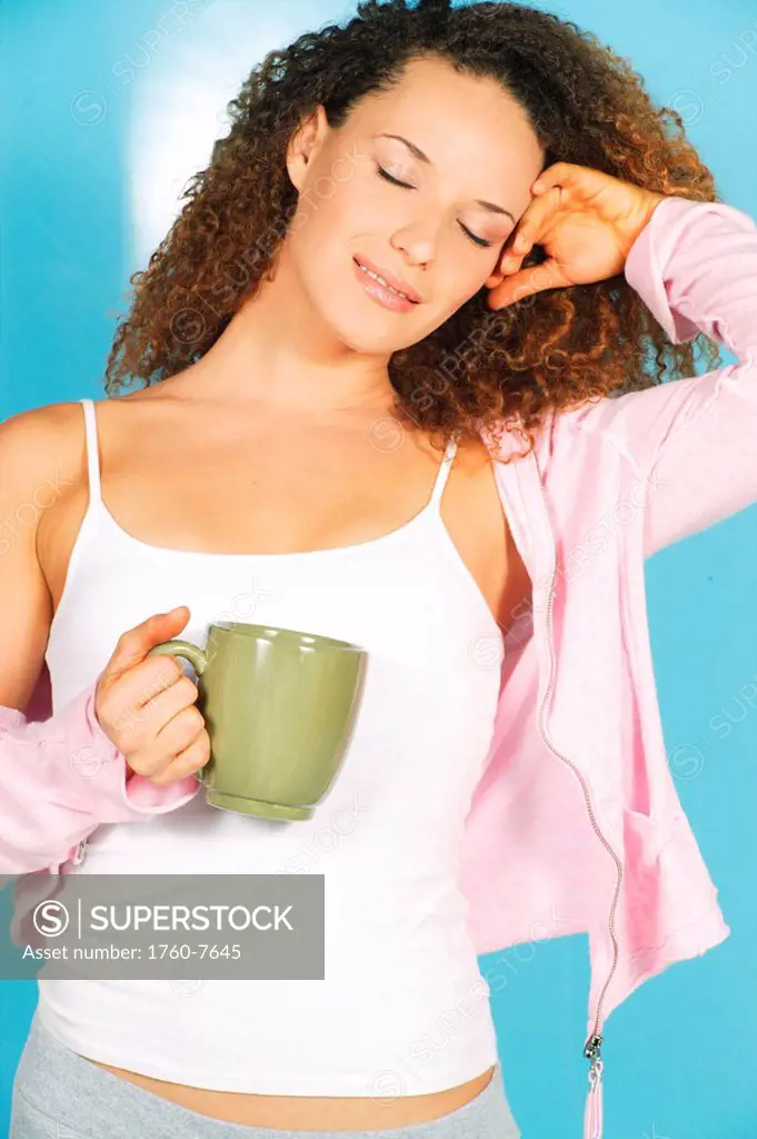 Studio image of Girl with green coffee mug