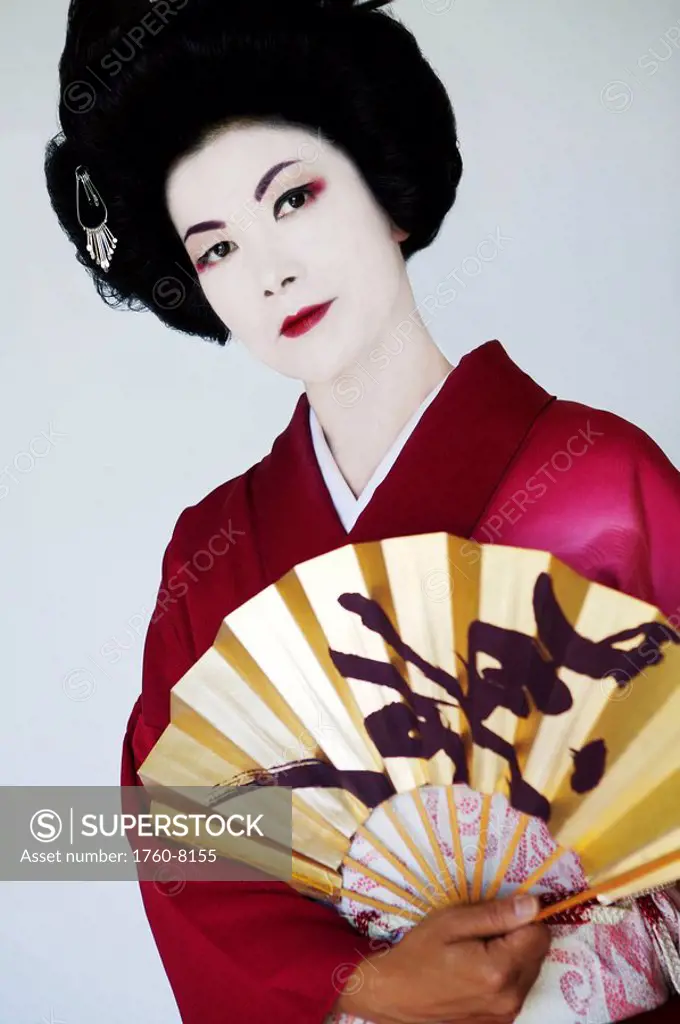 Traditional portrait of a Geisha with Japenese fan.