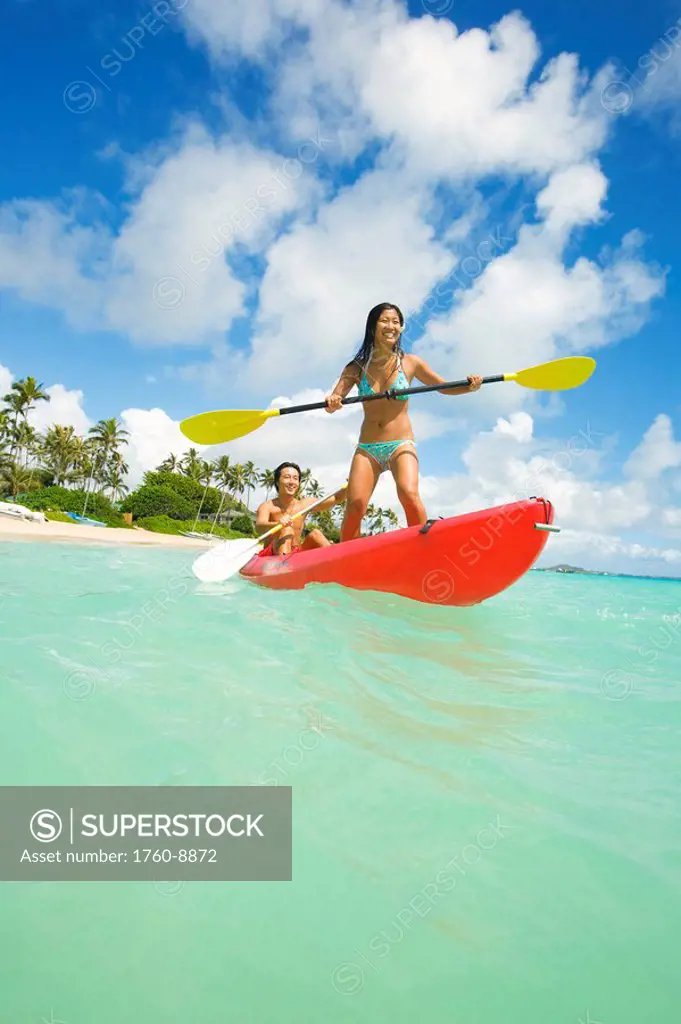 Hawaii, Oahu, Lanikai, Japanese couple kayaking in the ocean.