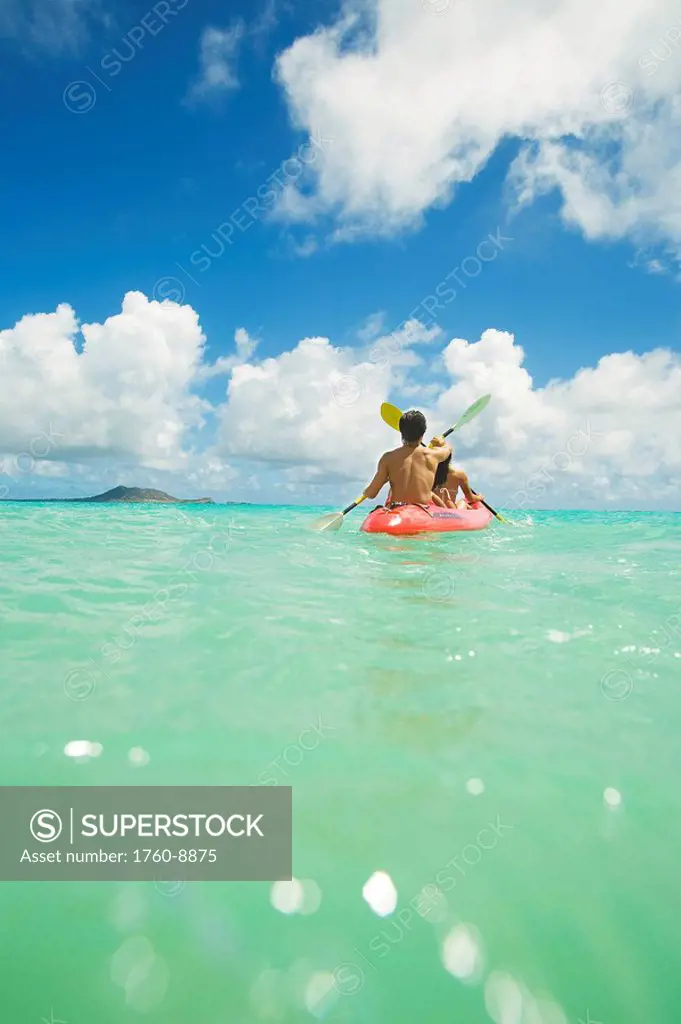 Hawaii, Oahu, Lanikai, Japanese couple kayaking in the ocean.