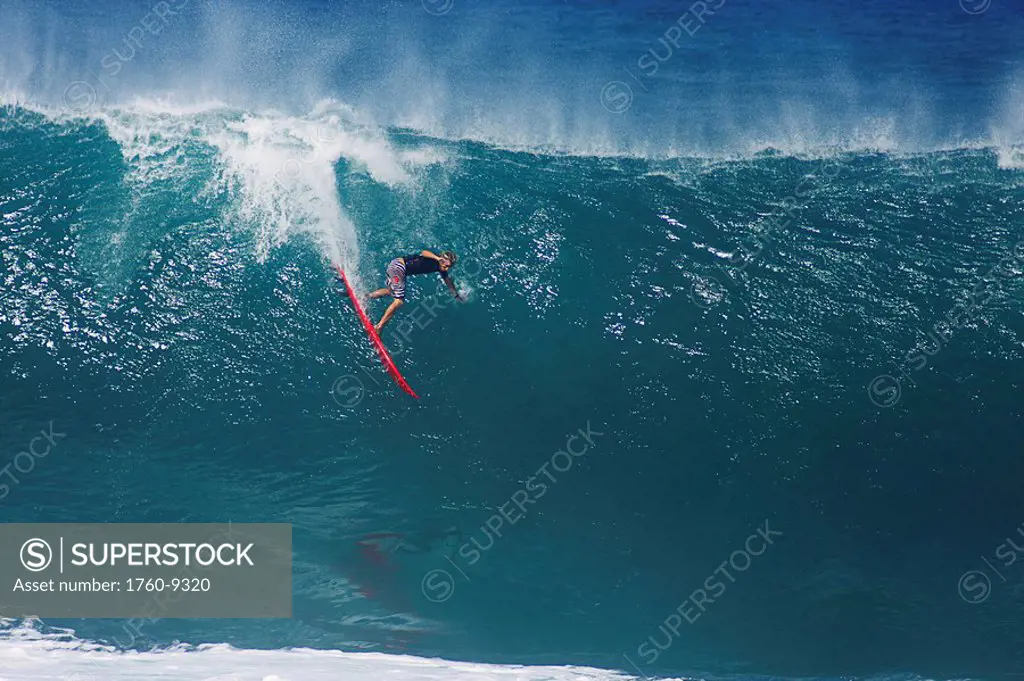 Hawaii, Oahu, North Shore, Pipeline, surfer, riding a large wave.
