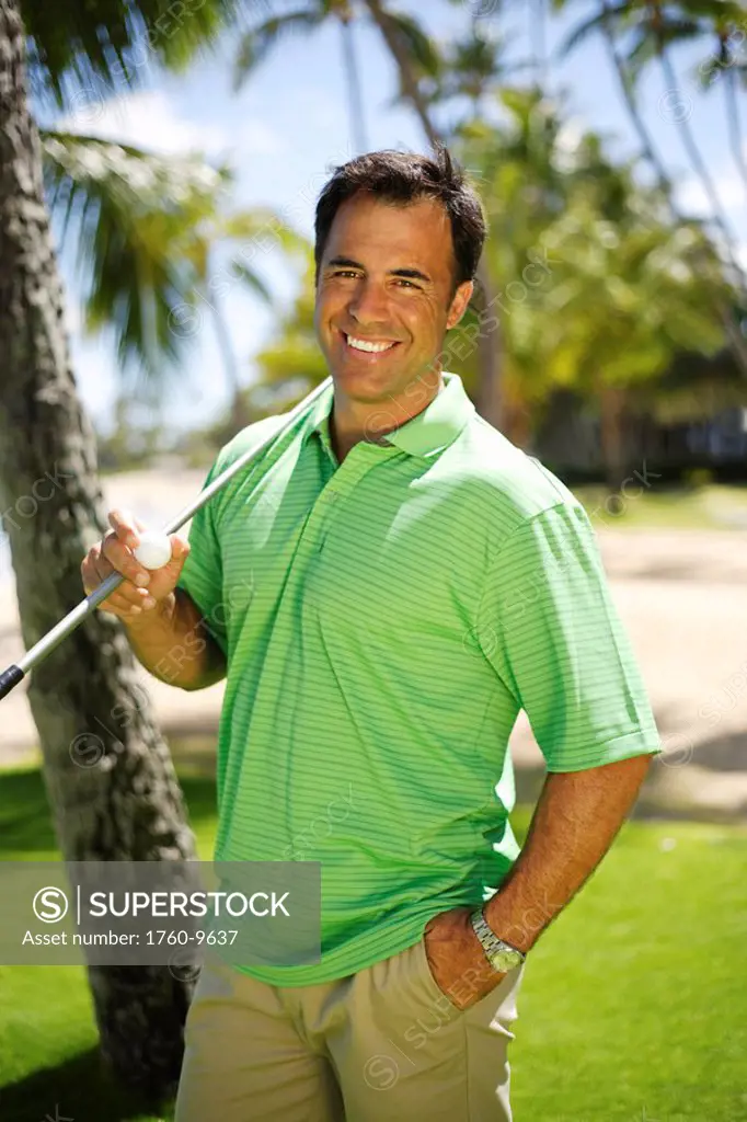 Hawaii, Oahu, Male golfer on golf course.