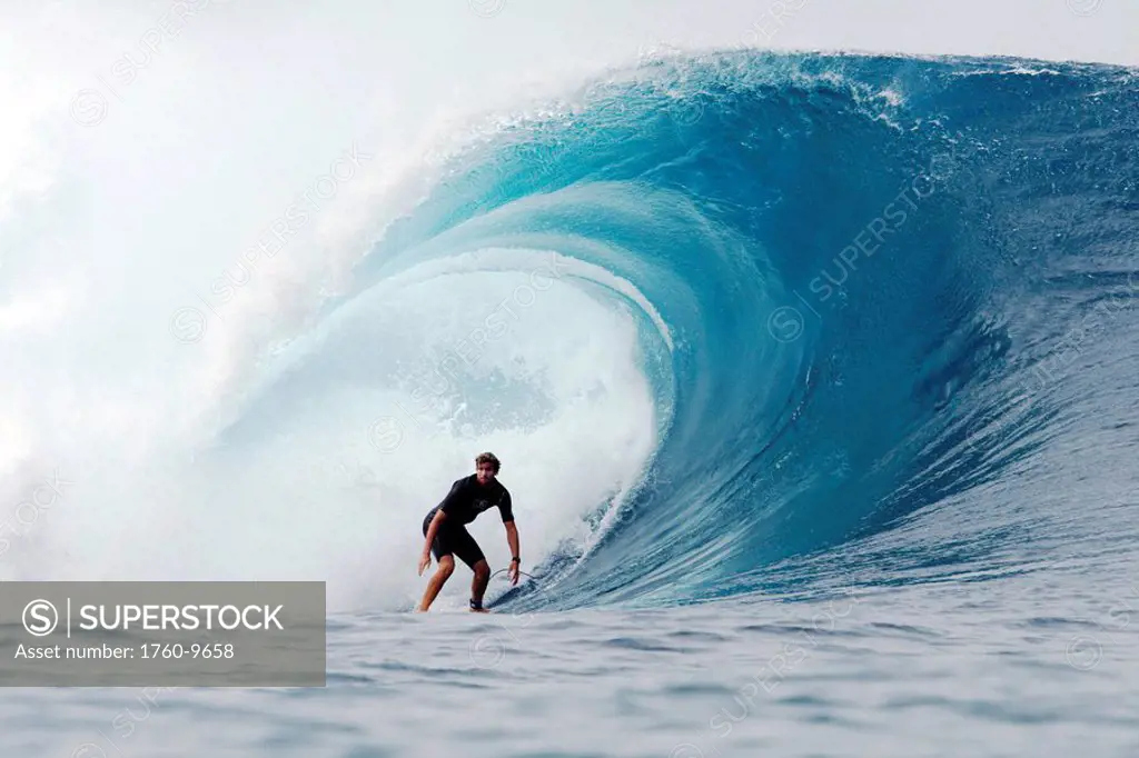 Hawaii, Oahu, North Shore, Pipeline, surfer, riding a wave.