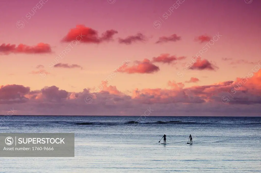 Hawaii, Oahu, North Shore, Stand up paddling at sunset.