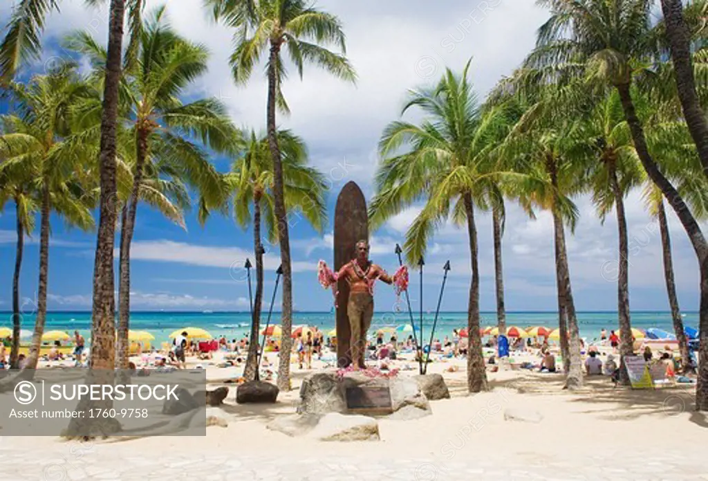 Hawaii, Oahu, Waikiki, Duke Kahanamoku statue in front of Kuhio Beach Park.