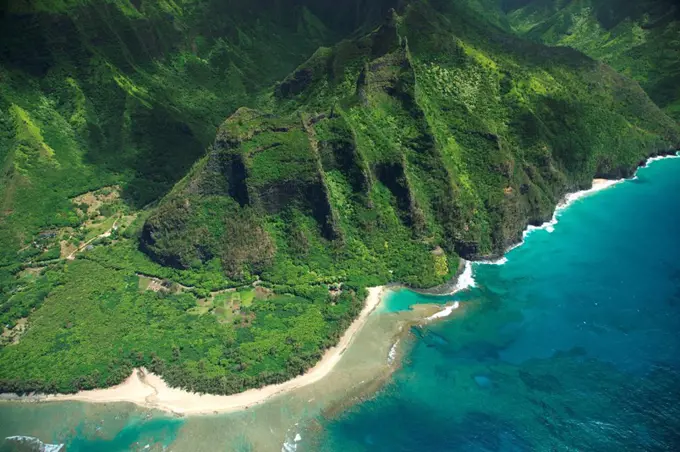 Hawaii, Kauai, Na Pali Coast, Aerial view of National Tropical Botanical Gardens Limahuli Gardens and Ke´e Beach.