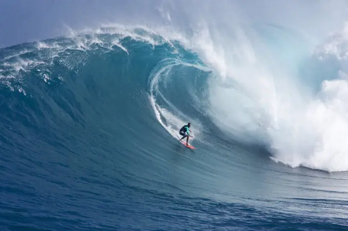 Hawaii, Maui, Yuri Farrant surfs huge wave at Jaws, aka Peahi.