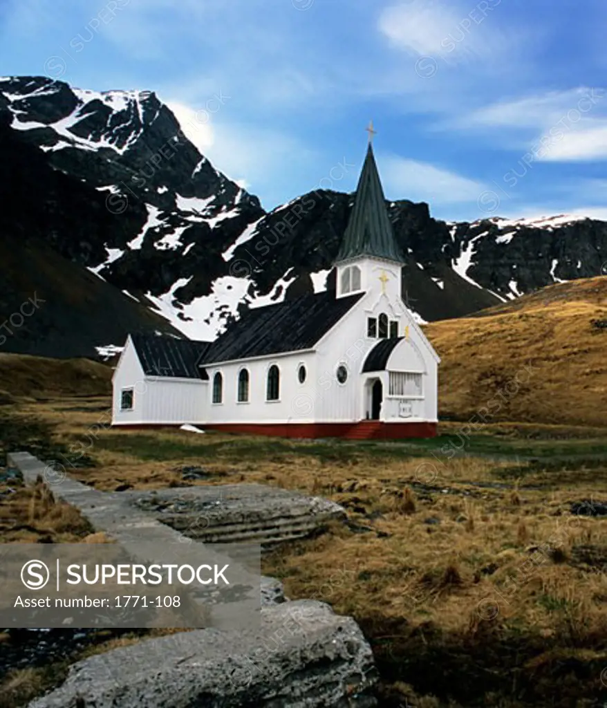 Church with snowcapped mountains in the background, Grytviken, South Georgia Island, Falkland Islands