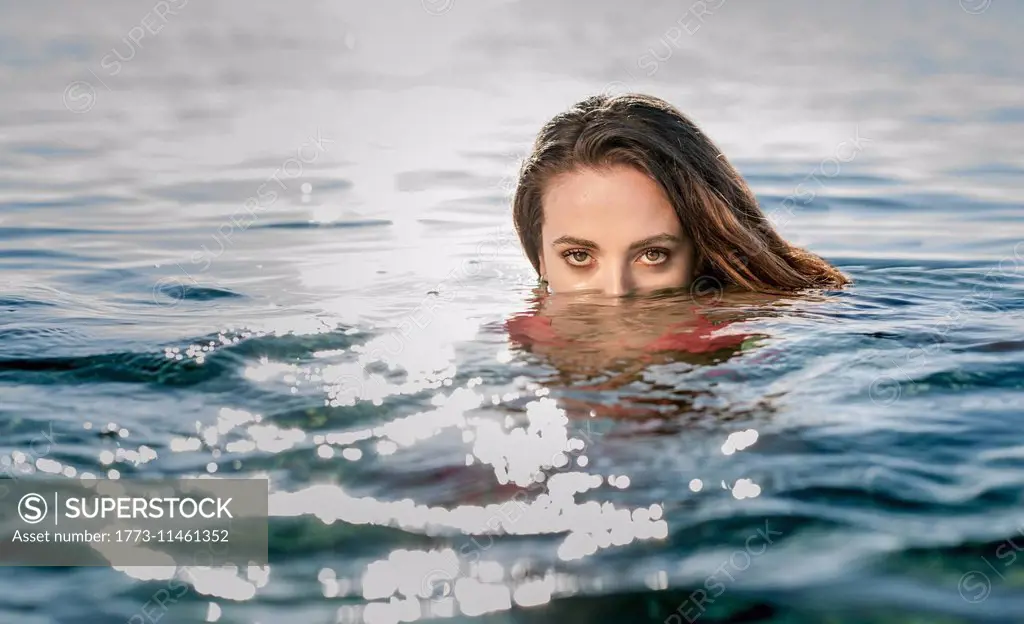Portrait of young woman in swimming in sea, Castiadas, Sardinia, Italy
