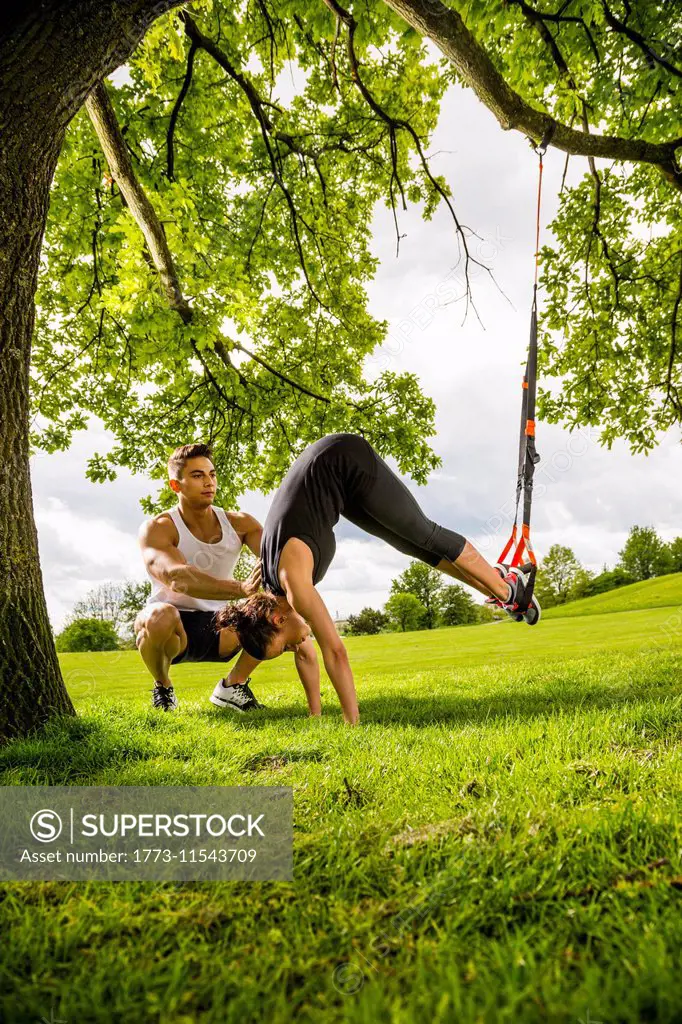 Personal trainers doing outdoor training in urban place, Munich, Bavaria, Germany