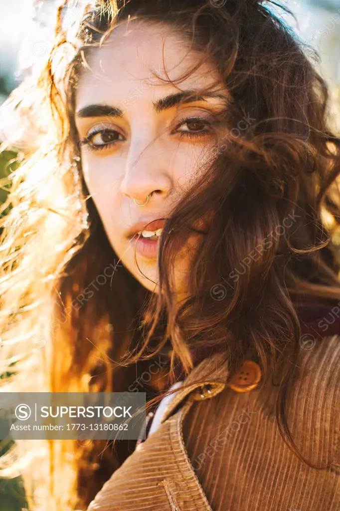 Portrait of young woman with wavy hair, close-up