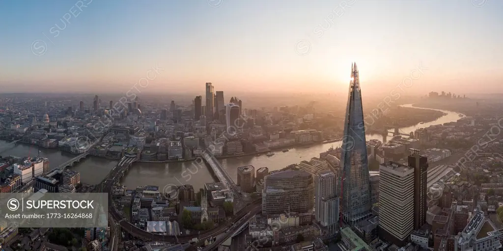 Aerial View of The Shard landmark tower and City of London, and the River Thames at dawn