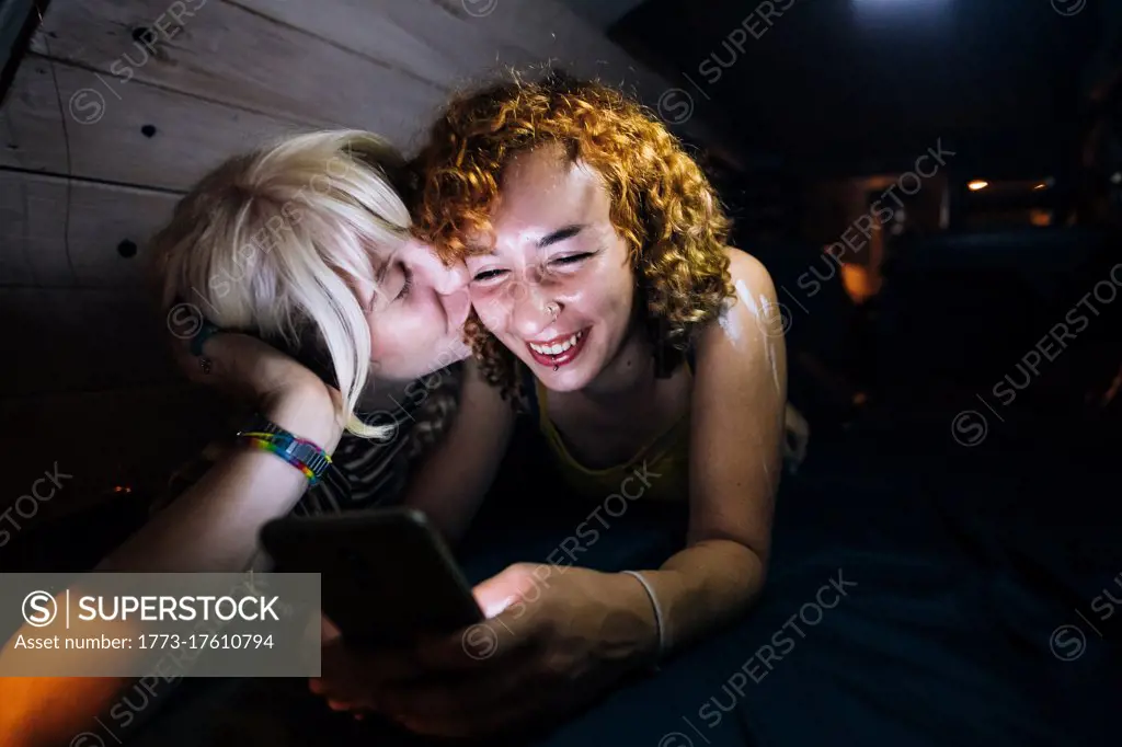 Young woman kissing her partner