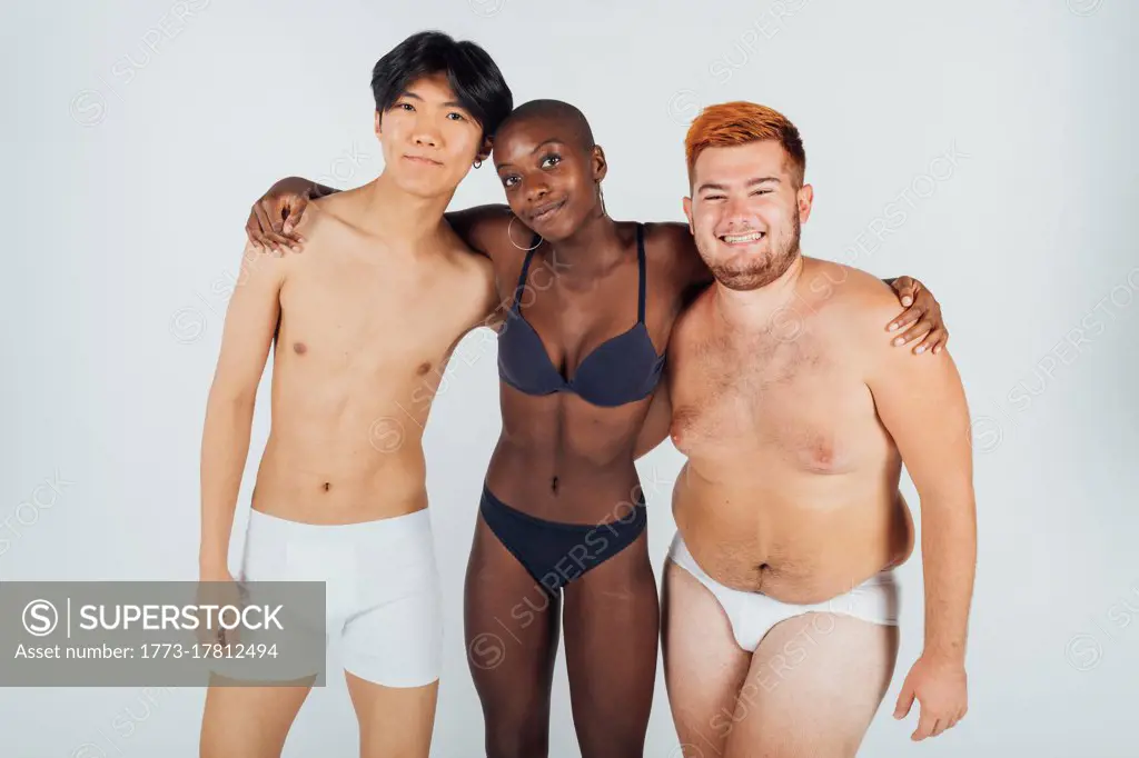 Female and male friends wearing underwear - SuperStock