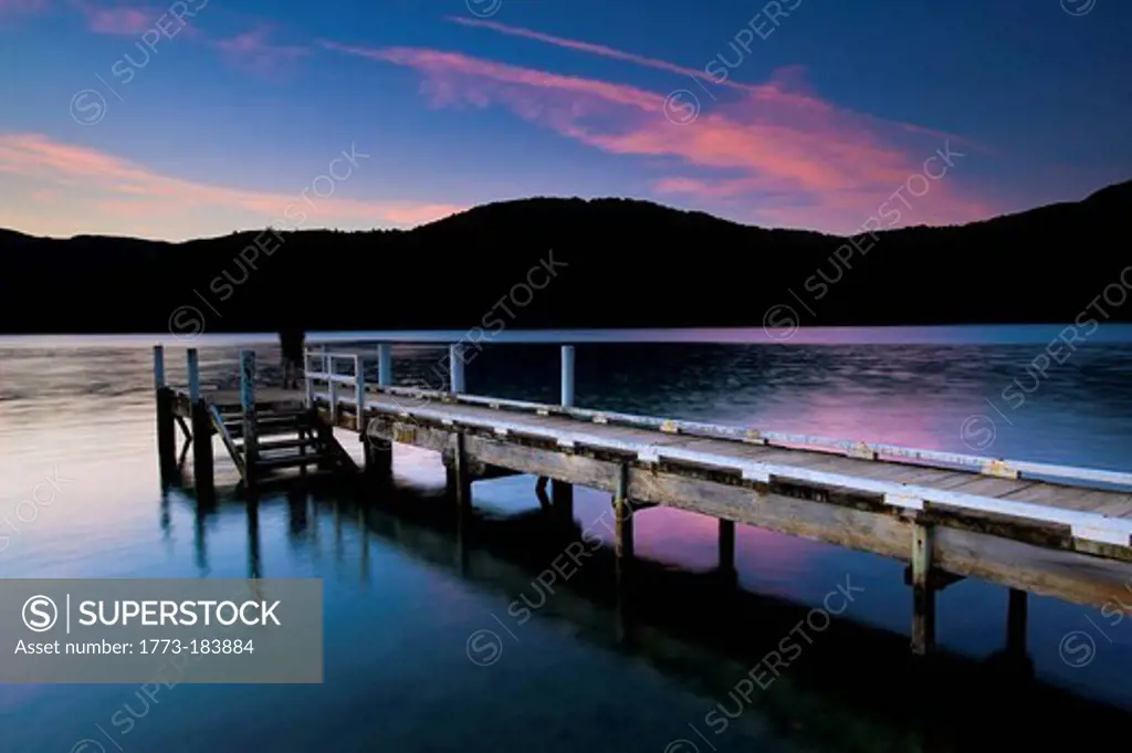 Wooden pier in still lake