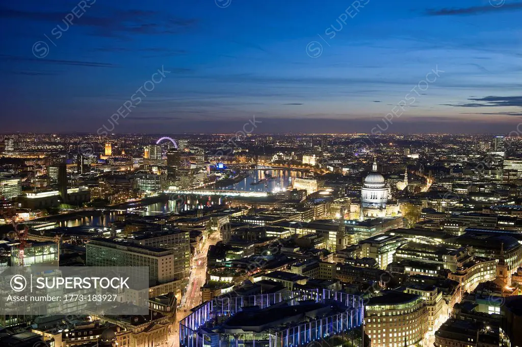Aerial view of cityscape lit up at night
