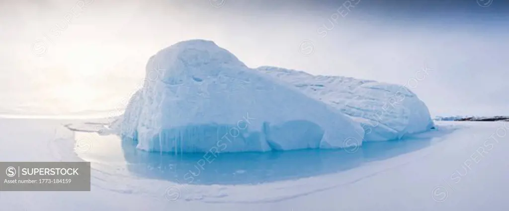 Snowy glacier in arctic water