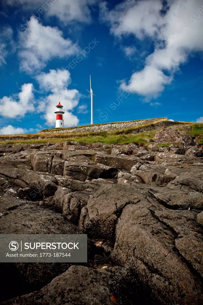 Lighthouse on rocky hill