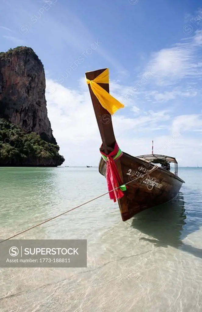 Boat docked in tropical beach