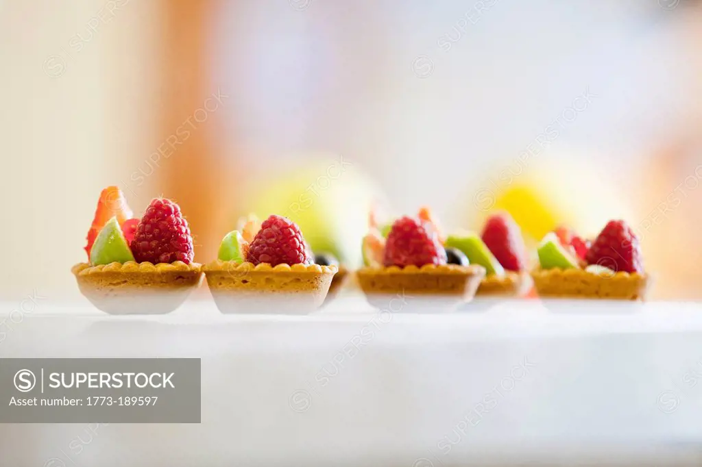 Close up of miniature fruit tarts