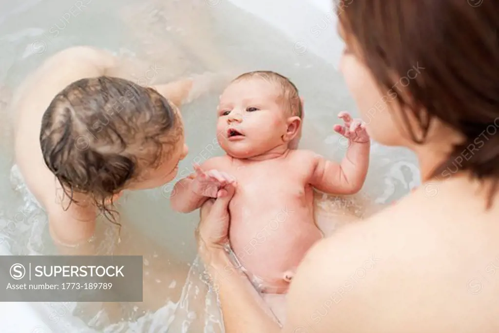 Mother taking bath with children