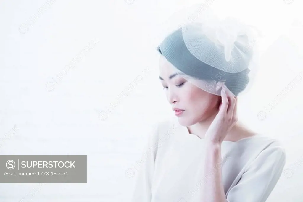 Woman wearing beanie hat indoors