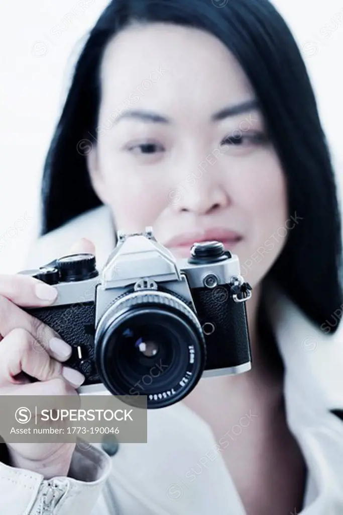 Woman taking pictures with camera
