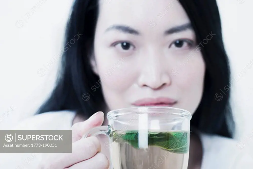 Woman having cup of tea