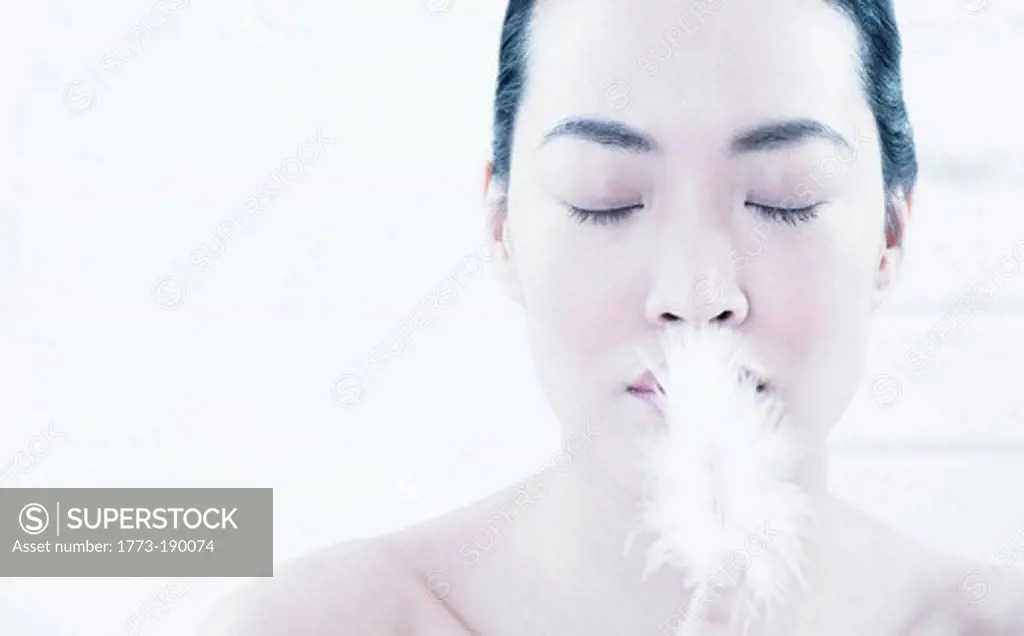Woman breathing in powder