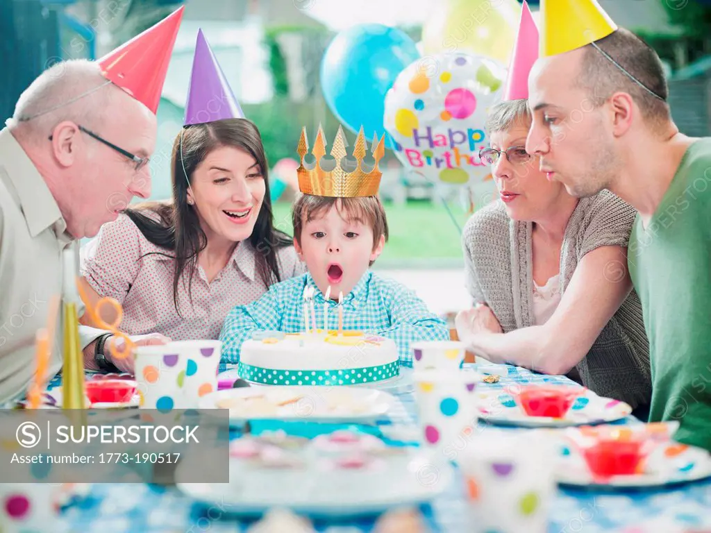 Boy with family at birthday party