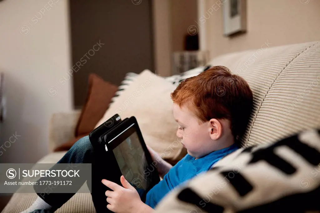 Boy with digital tablet