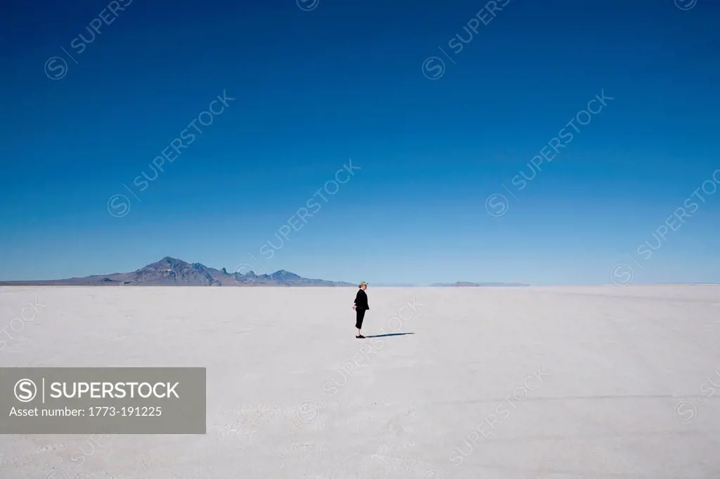 Woman standing on the Bonneville Salt Flats, Tooele County, Utah, USA