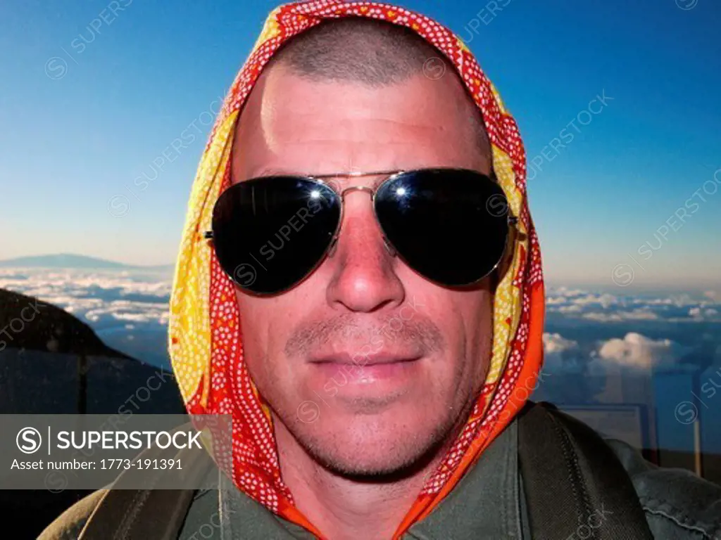 Man wearing a headscarf and sunglasses