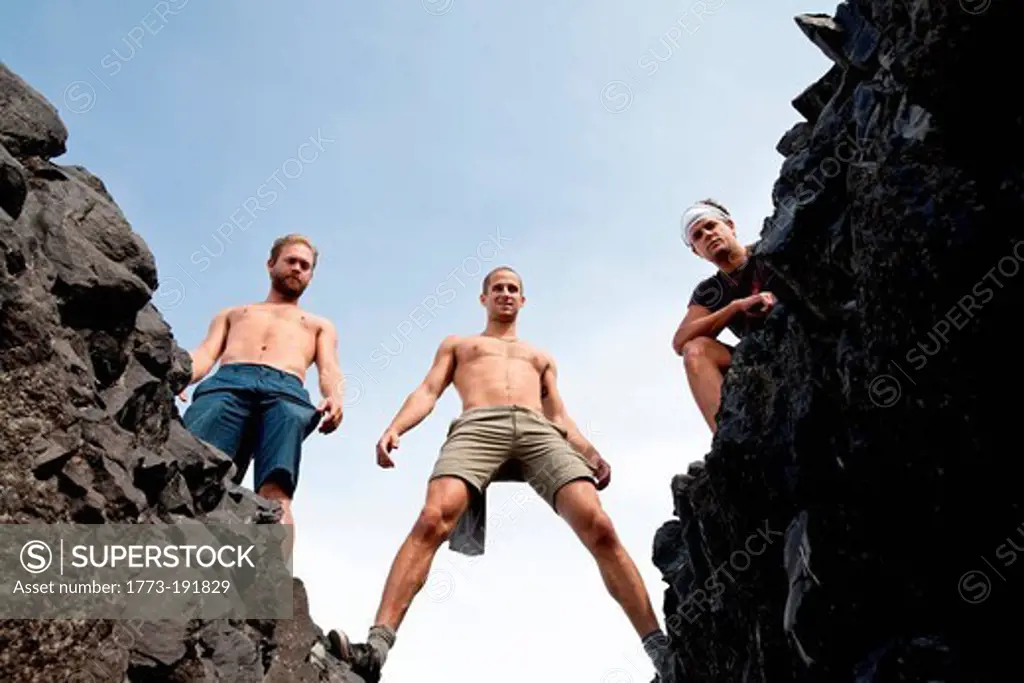Three men standing on rocks, Black Tusk, Garibaldi Provincial Park, British Columbia, Canada