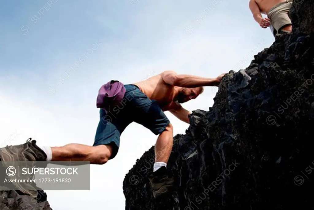 Man climbing rocks, Black Tusk, Garibaldi Provincial Park, British Columbia, Canada