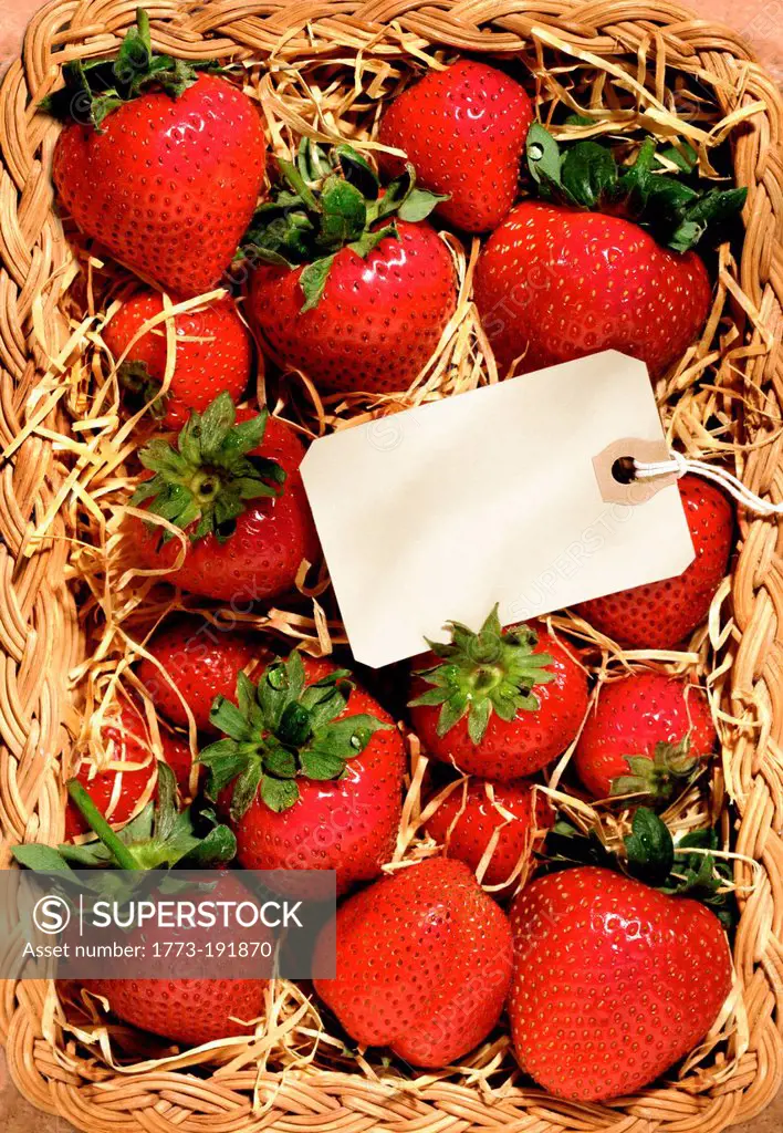 Strawberries in a basket with blank tag