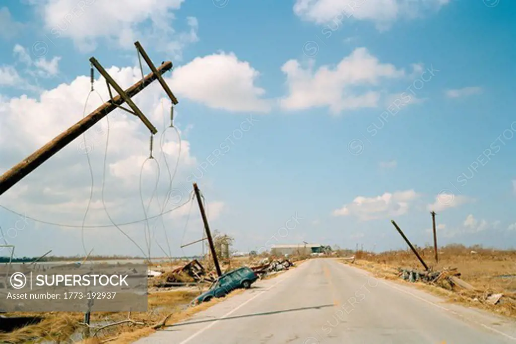 Fallen telephone poles and crashed car, aftermath of Hurricane Katrina, Cameron, Louisiana. USA