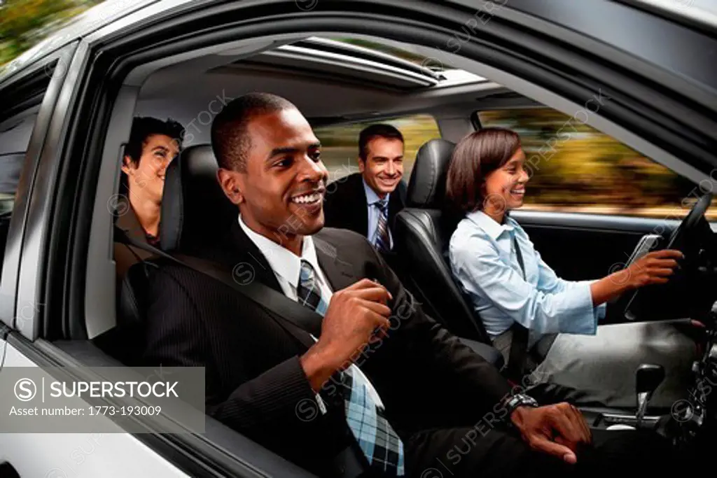 Businessmen and women haring car to work