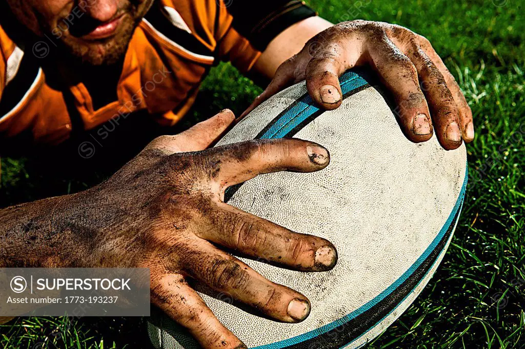 Rugby player scoring on pitch