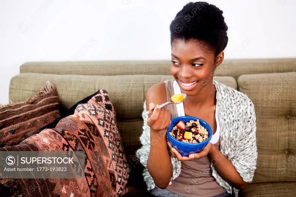 Young woman having healthy breakfast