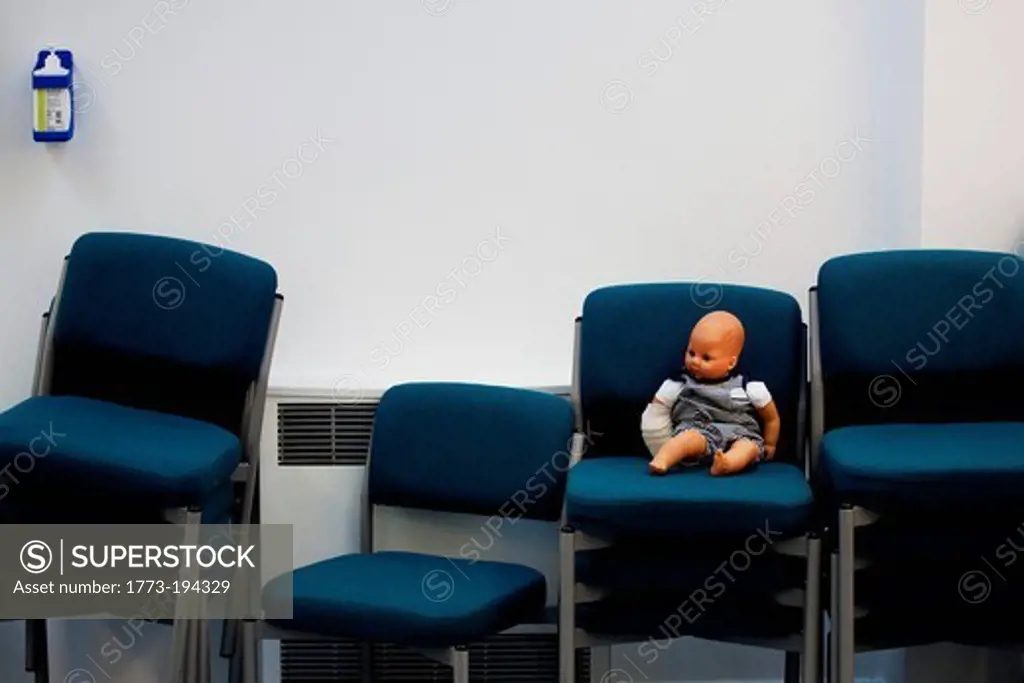 Doll on office chair