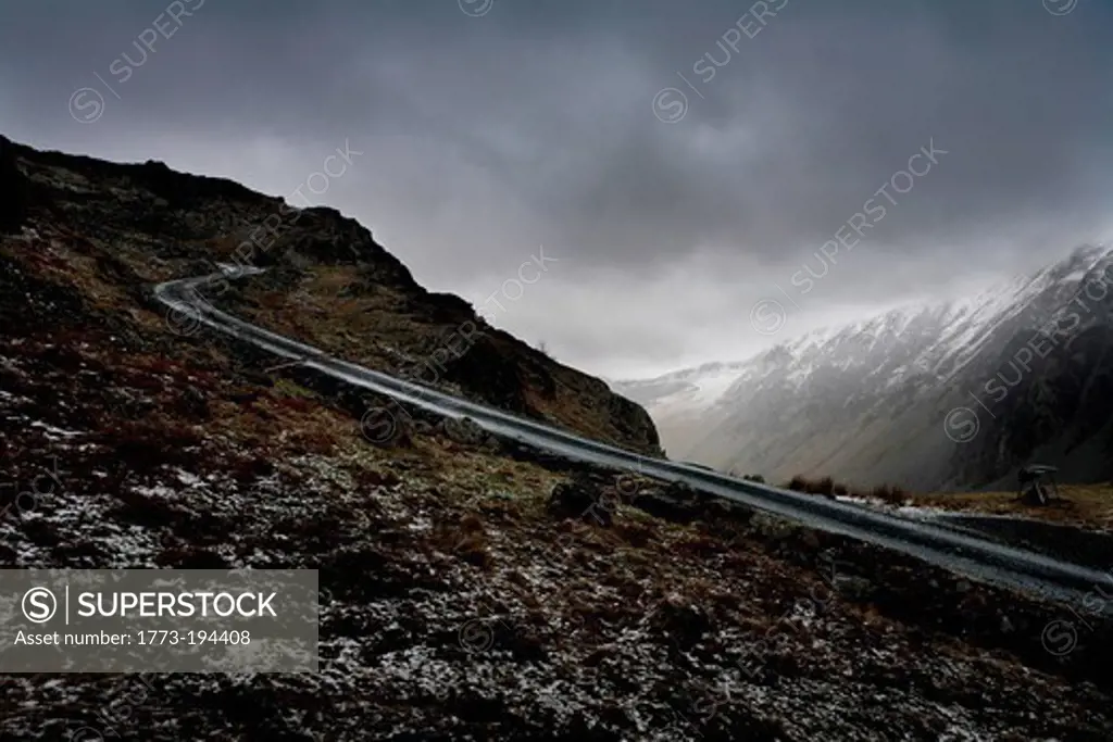 Snow and mountain road, Lake District, Cumbria, England, UK