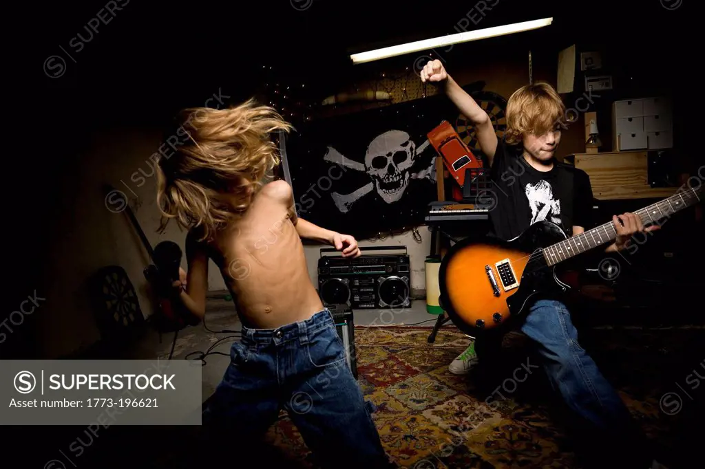 Young brothers playing rock music